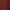 Une main tient une assiette avec un morceau de gâteau devant un fond rouge avec des néons formant des étoiles et des lettres